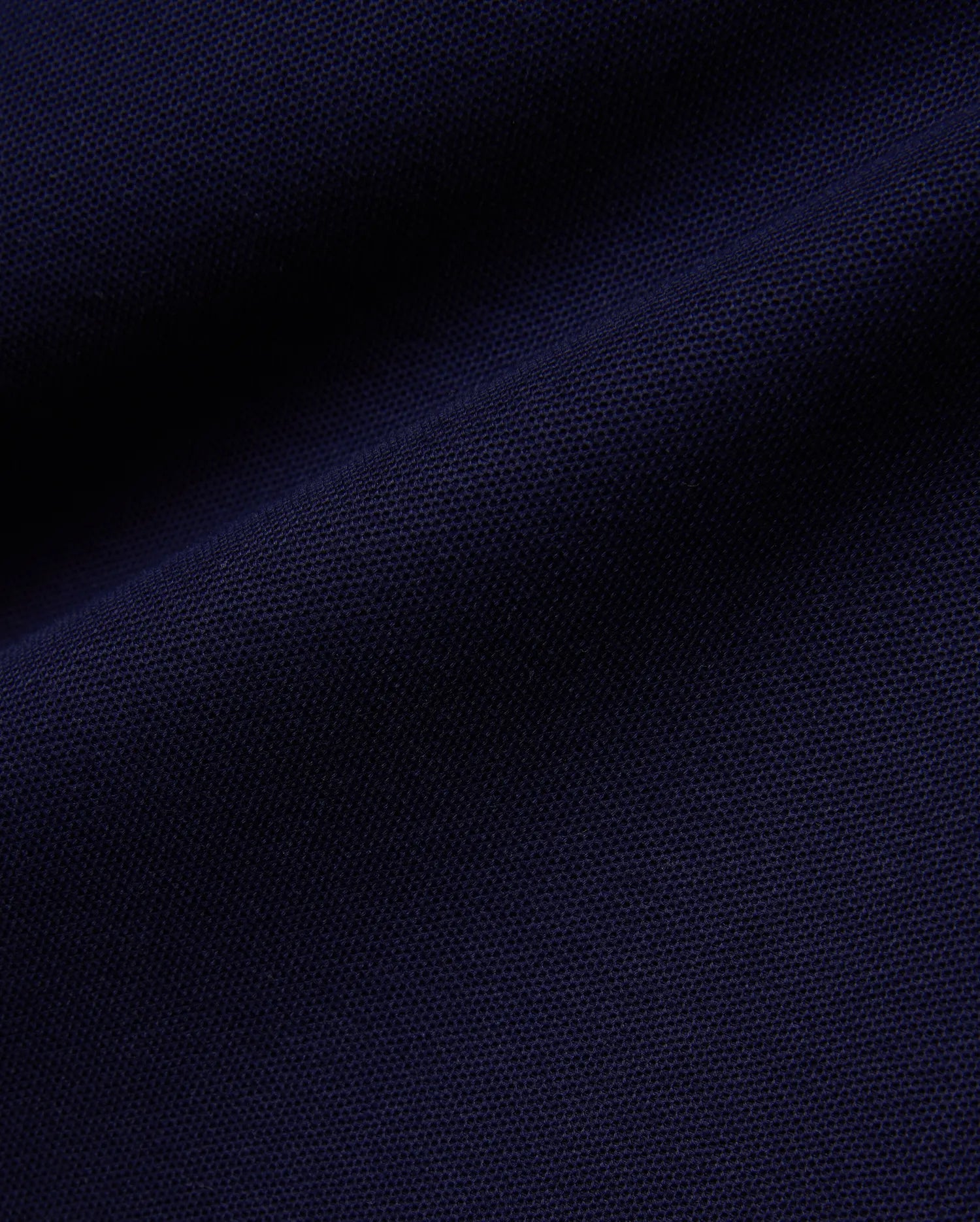 Deep navy Mens Blythe Pique Polo, featuring a classic fit, textured pique fabric, and the iconic small embroidered Psycho Bunny skull logo on the chest.