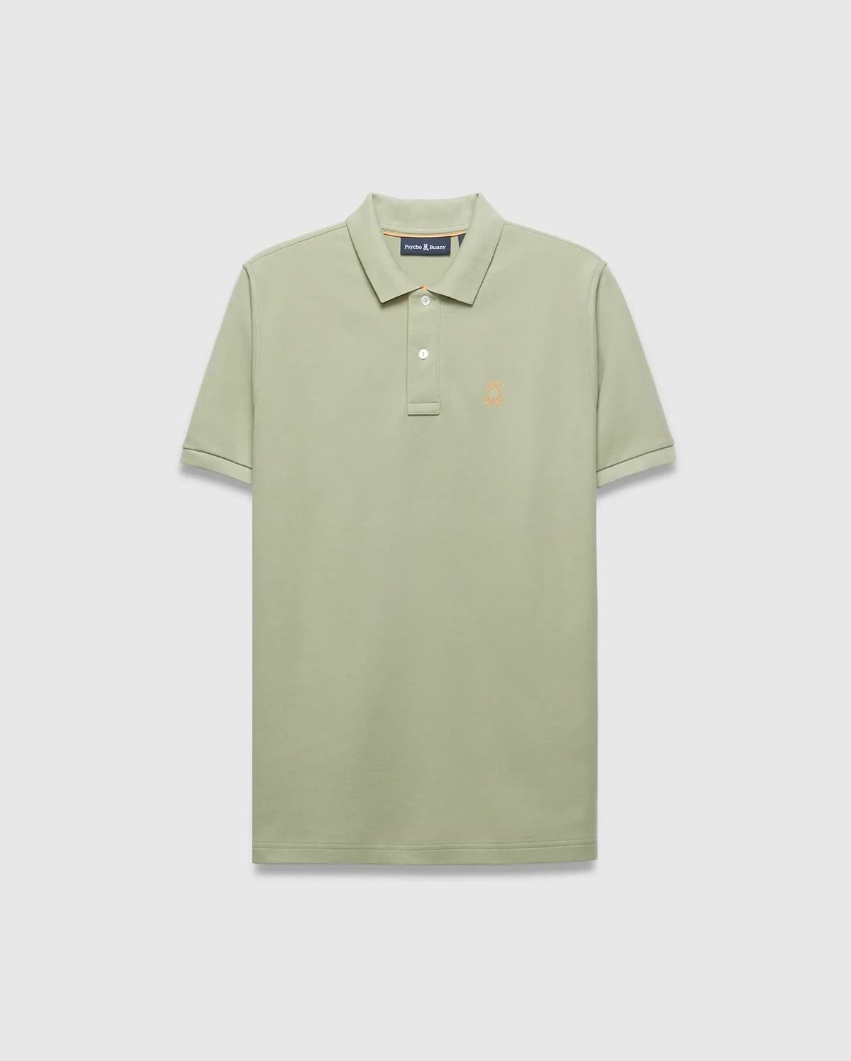 Mens Blythe Pique Polo in sage green, a classic fit polo with textured pique fabric, two-button placket, and a small embroidered orange Psycho Bunny skull logo on the left chest.