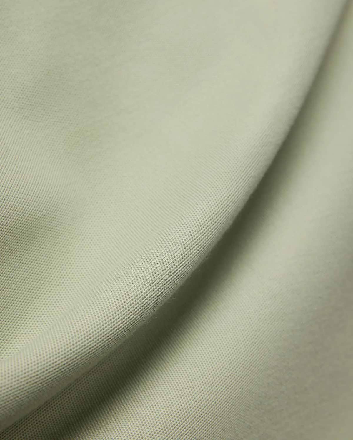 MENS BLYTHE PIQUE POLO, featuring a luxurious, breathable light sage green pique fabric with a distinctive textured weave, reflecting Psycho Bunny's premium menswear quality.