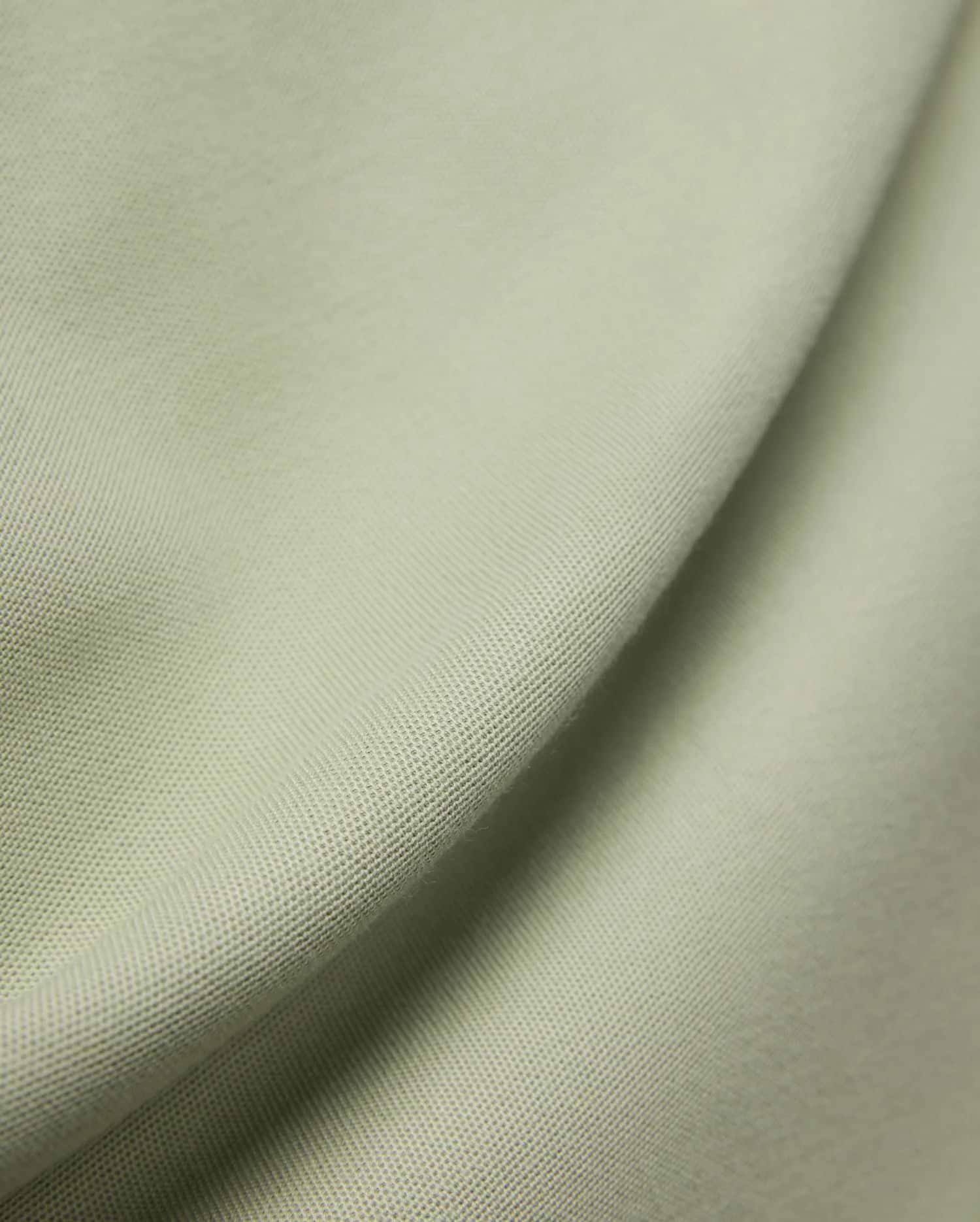 MENS BLYTHE PIQUE POLO, featuring a luxurious, breathable light sage green pique fabric with a distinctive textured weave, reflecting Psycho Bunny's premium menswear quality.