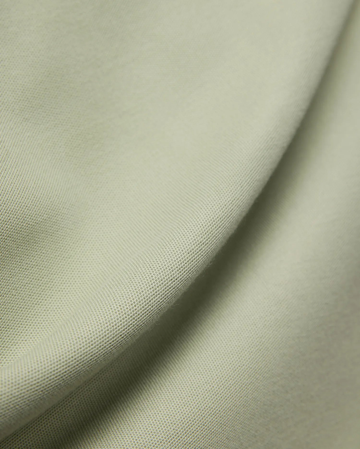 MENS BLYTHE PIQUE POLO, featuring a luxurious, breathable light sage green pique fabric with a distinctive textured weave, reflecting Psycho Bunny's premium menswear quality.