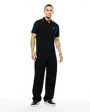 Men's Klaus Pique Polo, a classic fit black pique polo with light blue tipping on the collar and sleeve cuffs, featuring a small embroidered Psycho Bunny skull logo on the left chest. (4)