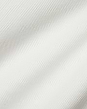 Crisp white Men's Klaus Pique Polo, crafted from premium textured pique fabric, featuring the iconic small embroidered Psycho Bunny skull logo on the left chest for refined streetwear style. (6)