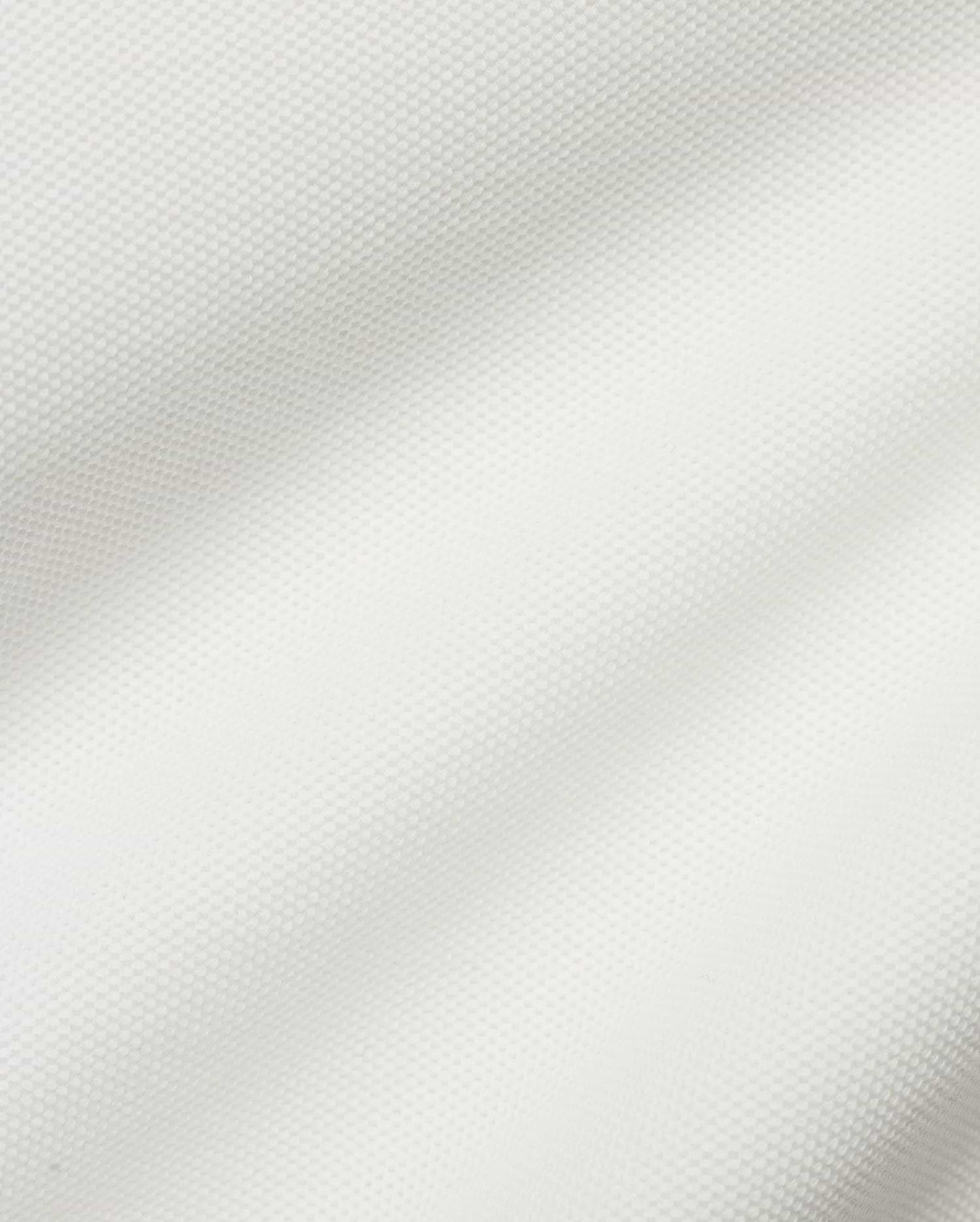 Crisp white Men's Klaus Pique Polo, crafted from premium textured pique fabric, featuring the iconic small embroidered Psycho Bunny skull logo on the left chest for refined streetwear style. (6)
