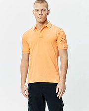 Mens Rhys Sport Polo, vibrant orange smooth performance jersey with white piping on shoulders and sides, classic fit, and small embroidered Psycho Bunny skull logo on left chest.