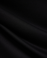 MENS TIERNAN PIQUE POLO in deep black, showcasing its premium, classic textured pique knit fabric with elegant folds, reflecting Psycho Bunny's refined streetwear aesthetic.