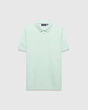Mens Tiernan Pique Polo in mint green, featuring a classic fit, pique knit texture, ribbed collar and cuffs with subtle stripe detail, three white button placket, and a small tonal embroidered Psycho Bunny skull logo on the left chest.