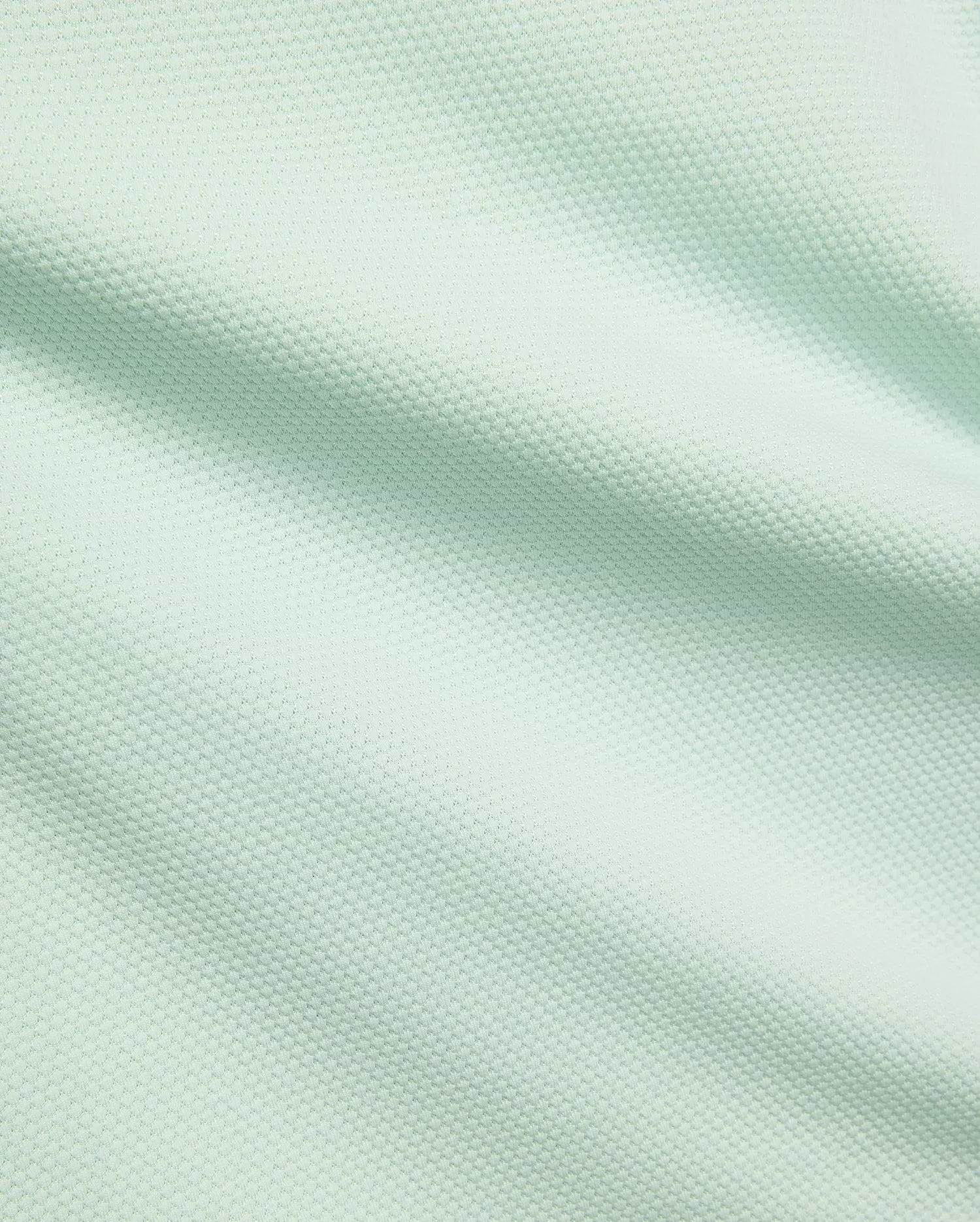 Mens Tiernan Pique Polo, a premium Psycho Bunny menswear piece, featuring a vibrant light mint green color and a finely textured, breathable pique fabric weave.