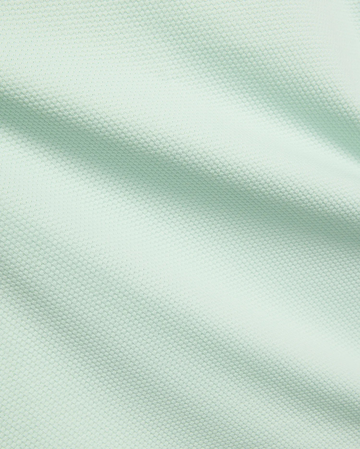 Mens Tiernan Pique Polo, a premium Psycho Bunny menswear piece, featuring a vibrant light mint green color and a finely textured, breathable pique fabric weave.