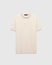 Cream Mens Tiernan Pique Polo, classic fit, featuring textured pique fabric, ribbed collar and cuffs, and a small embroidered Psycho Bunny skull logo on the left chest.