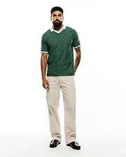 Mens Garry Jacquard Johnny Collar Polo in dark green, featuring an all-over bunny skull jacquard pattern, a white Johnny collar, and white striped cuffs, in a classic fit textured knit. (7)