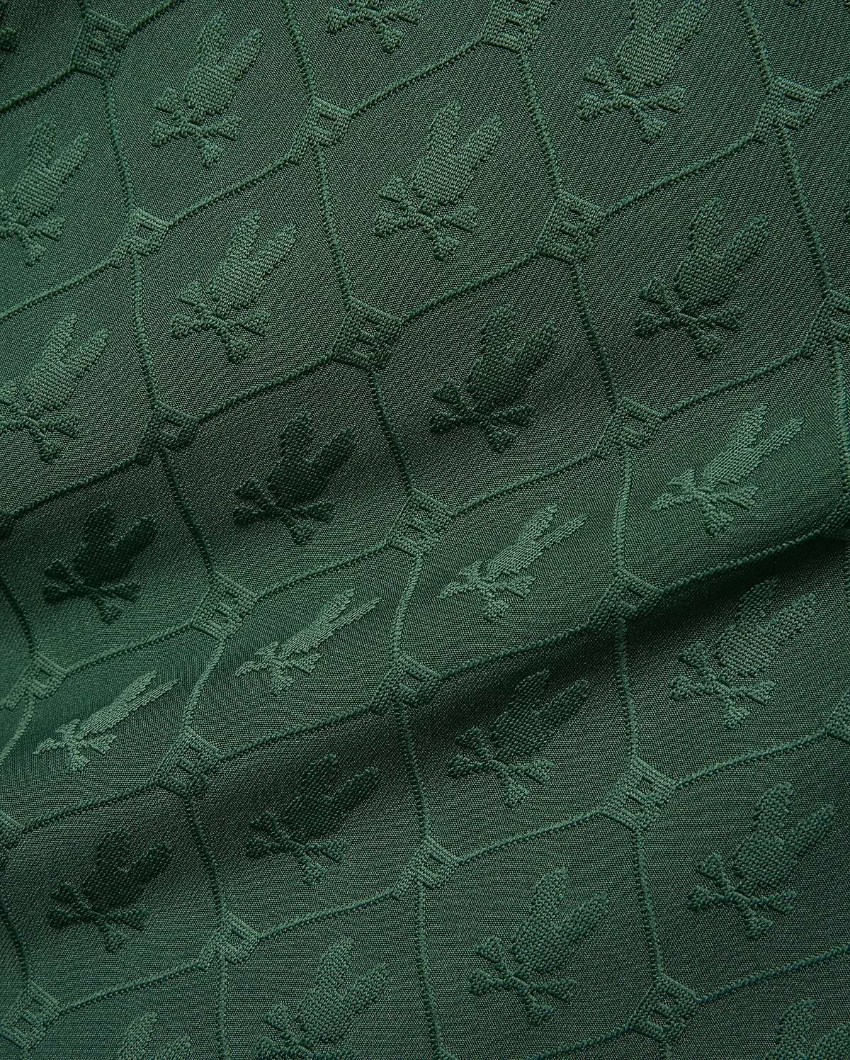 Mens Garry Jacquard Johnny Collar Polo in deep green, featuring an all-over tonal jacquard pattern of the iconic Psycho Bunny skull logo within a hexagonal grid. (9)