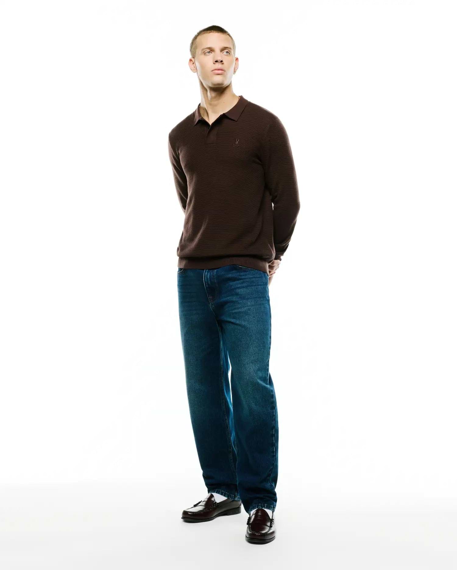 Men's Leroy Longsleeve Knit Polo, a classic fit brown horizontally ribbed knit polo with a small embroidered Psycho Bunny skull logo on the left chest. (4)