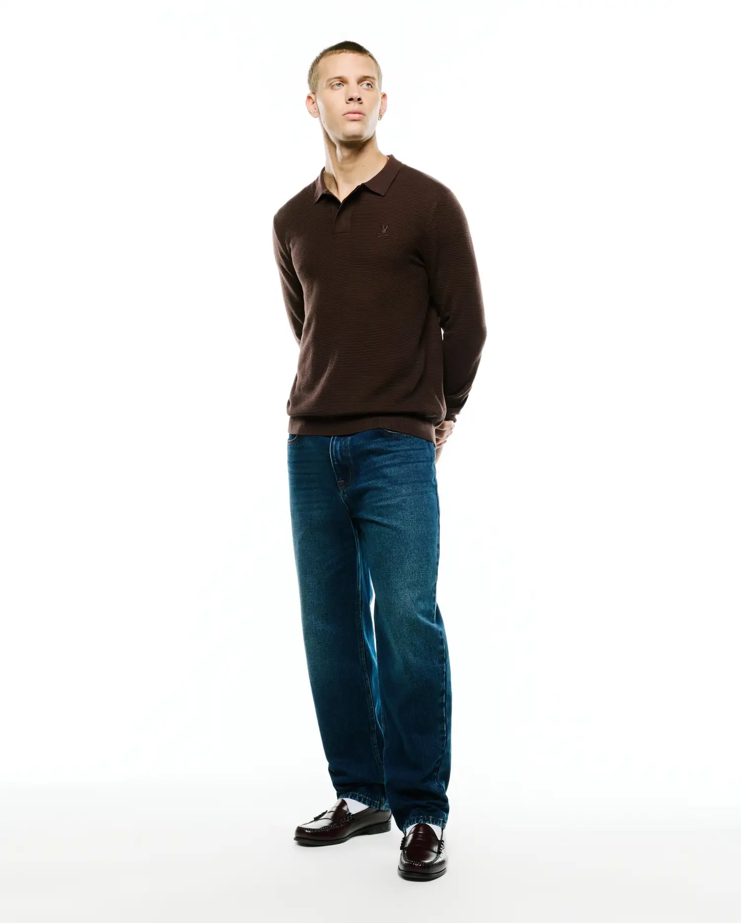 Men's Leroy Longsleeve Knit Polo, a classic fit brown horizontally ribbed knit polo with a small embroidered Psycho Bunny skull logo on the left chest. (4)