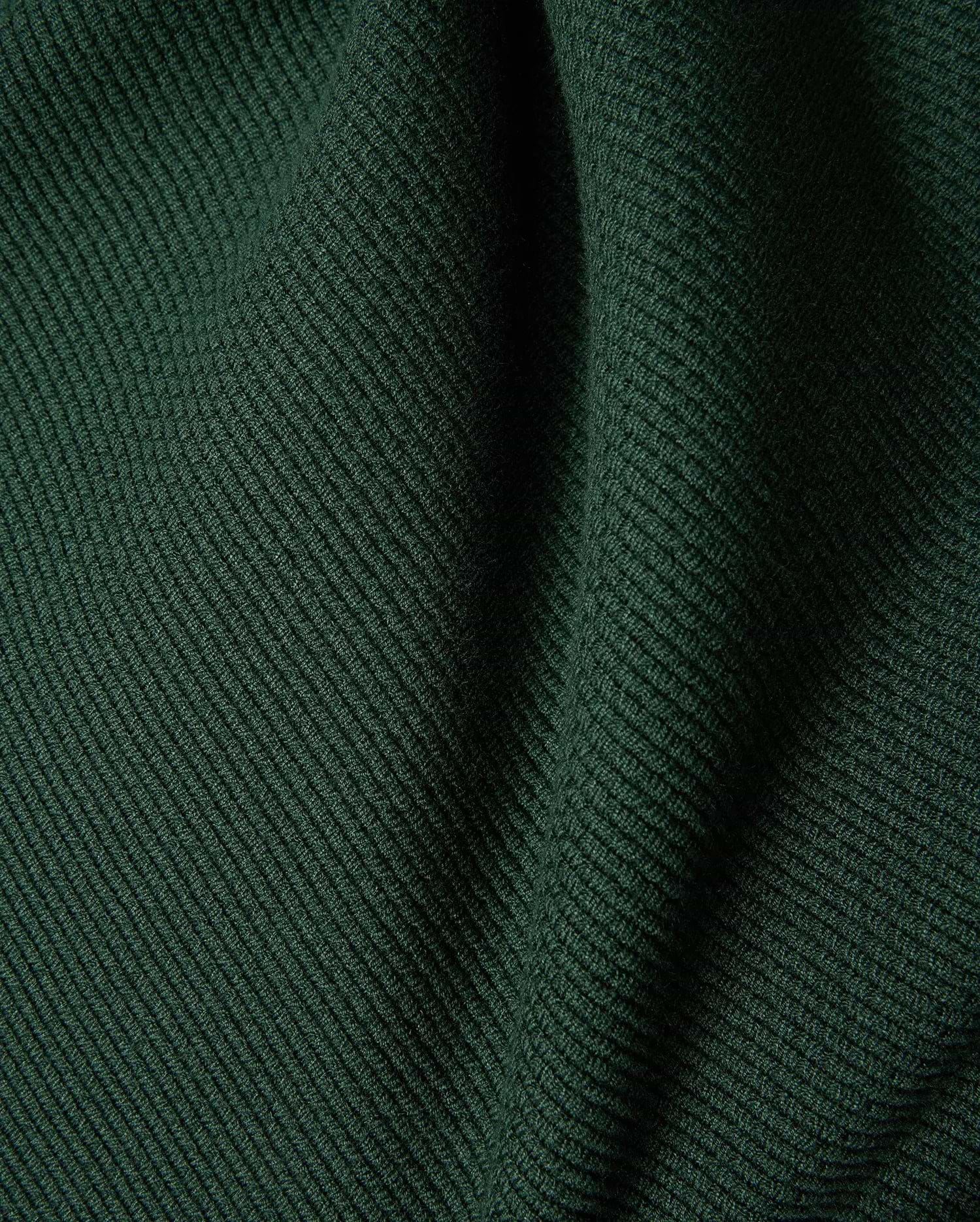 Mens Leroy Long Sleeve Knit Polo in dark green, featuring a prominent ribbed knit texture with subtle fabric folds. (6)