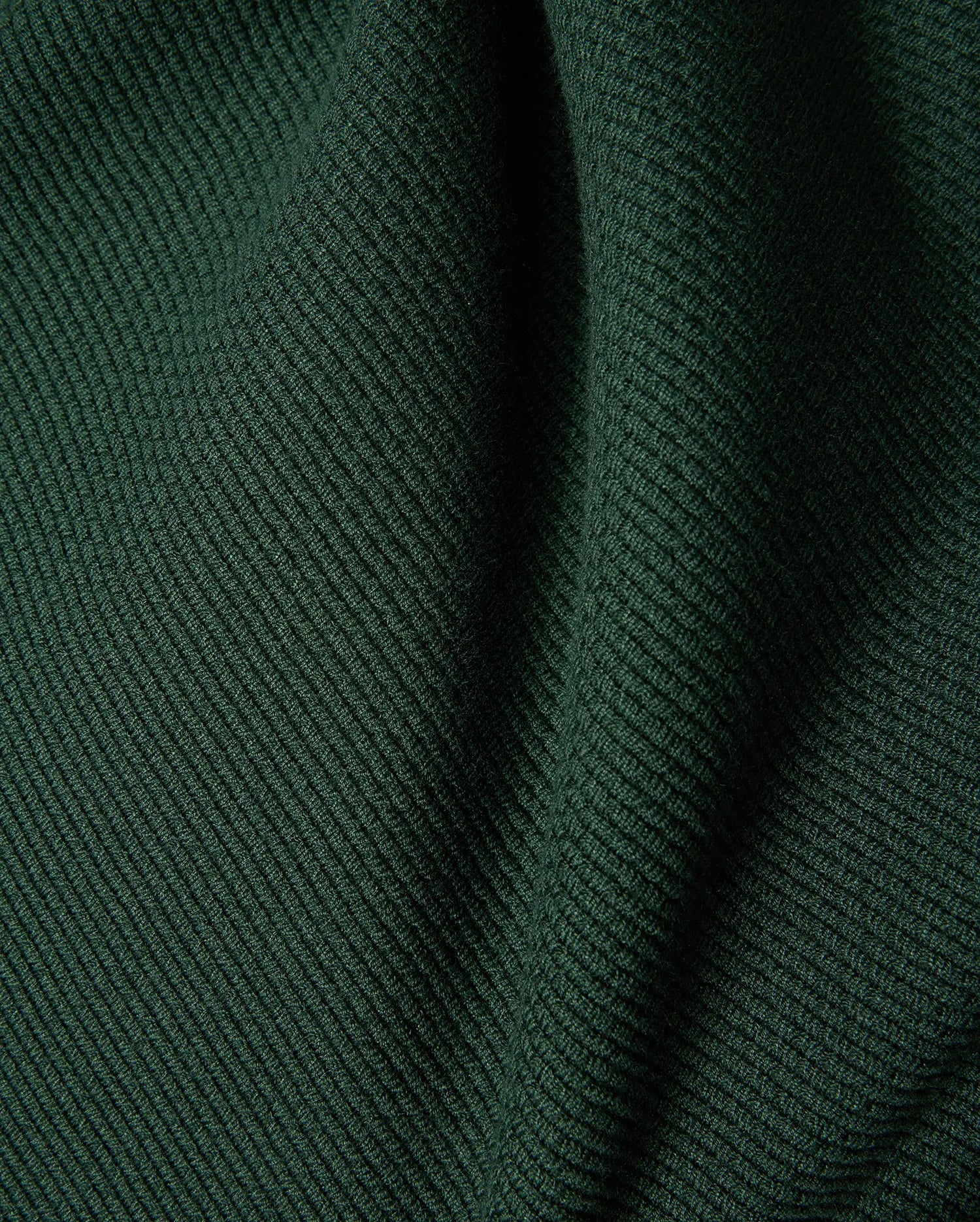 Mens Leroy Long Sleeve Knit Polo in dark green, featuring a prominent ribbed knit texture with subtle fabric folds. (6)