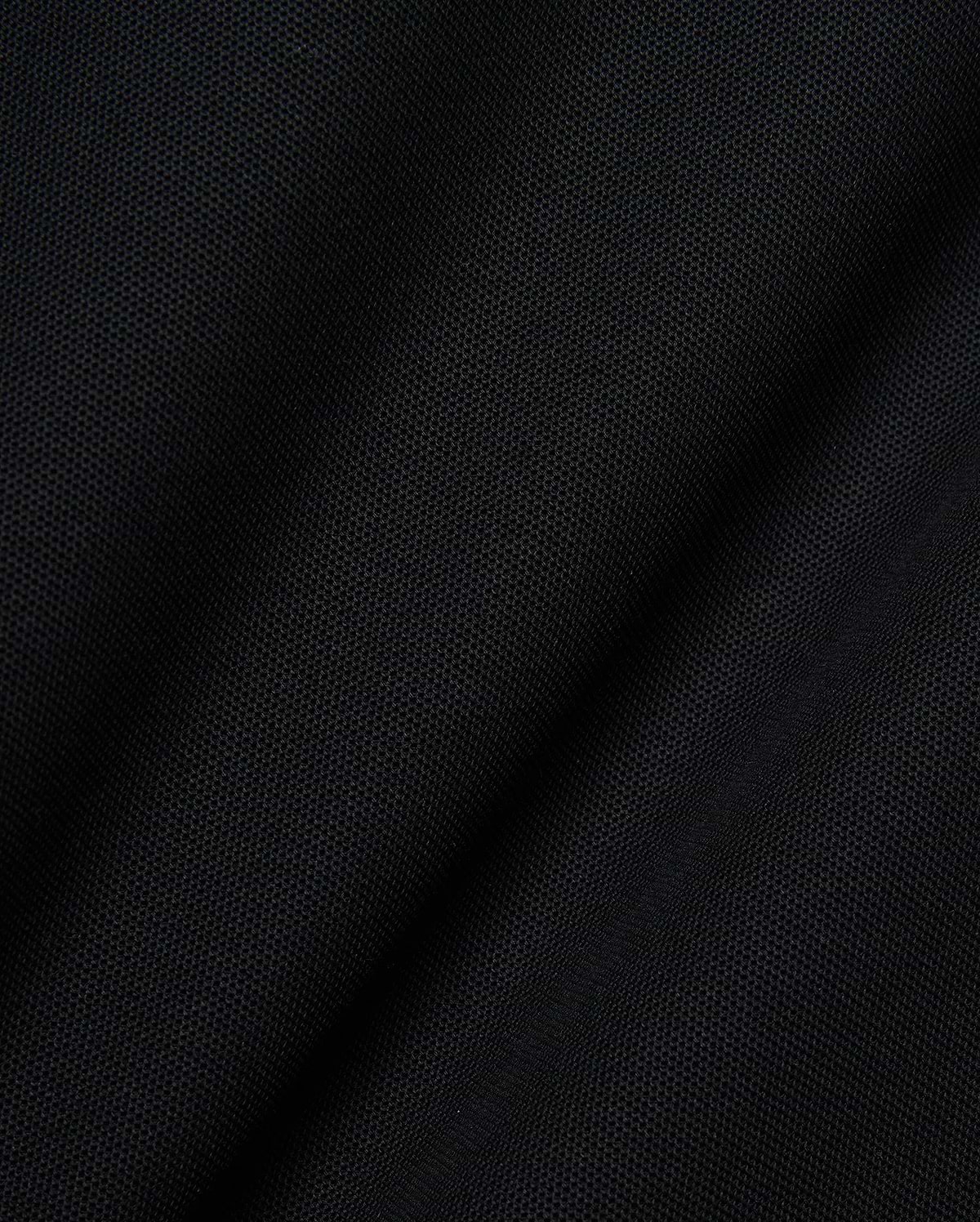 Mens Robin Pique Polo, a premium black pique knit fabric showcasing its distinctive textured weave and subtle drape, embodying Psycho Bunny's refined streetwear quality.