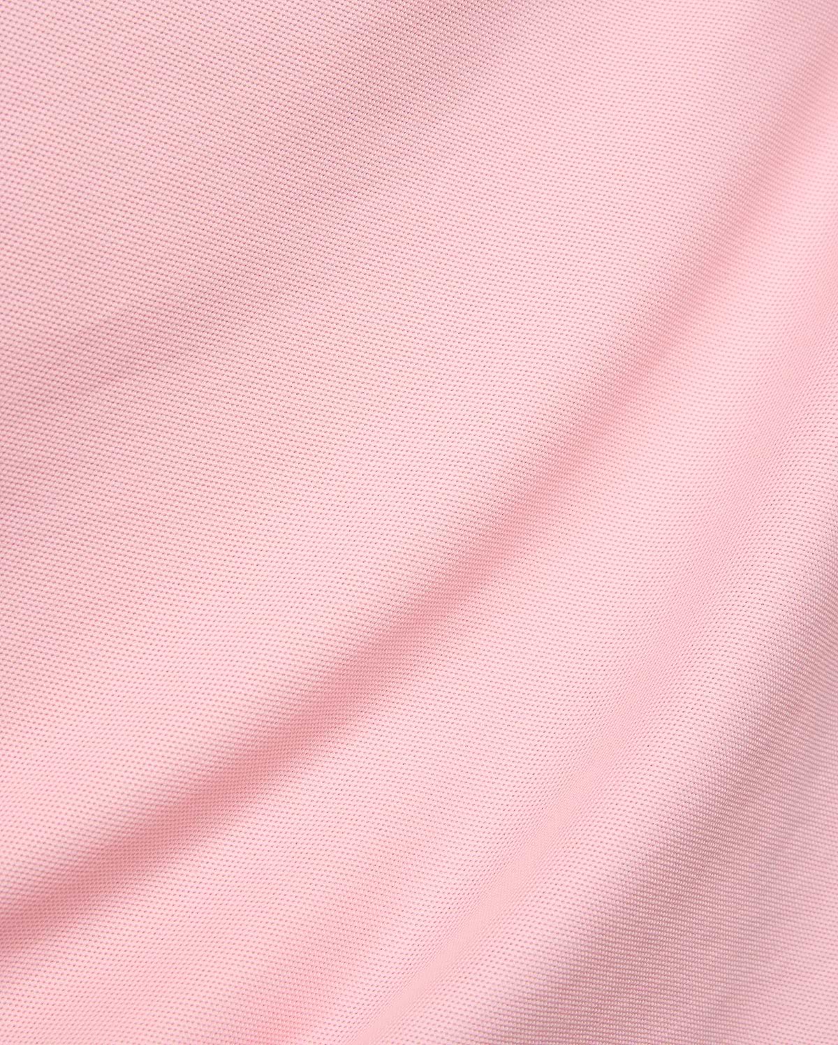 Mens Robin Pique Polo in a vibrant blush pink, showcasing its premium, classic textured pique knit fabric with elegant, soft folds, reflecting Psycho Bunny's refined streetwear aesthetic.