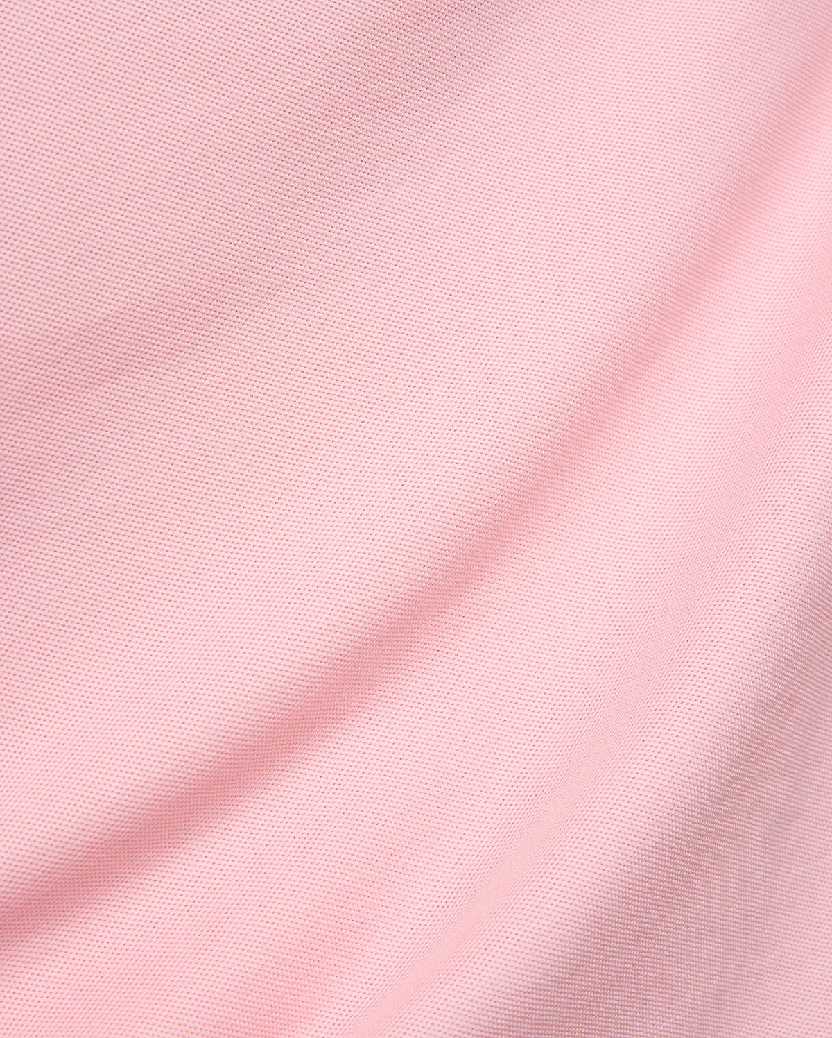 Mens Robin Pique Polo in a vibrant blush pink, showcasing its premium, classic textured pique knit fabric with elegant, soft folds, reflecting Psycho Bunny's refined streetwear aesthetic.