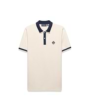 Mens Robin Pique Polo, a classic fit cream pique polo with navy blue ribbed collar, two-button placket, cuffs, and an embroidered Psycho Bunny skull logo on the left chest.
