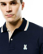 Men's Grover Pique Longsleeve Polo: Navy blue pique knit, classic fit, beige placket, ribbed collar with light blue/beige tipping, small embroidered light blue Psycho Bunny skull logo left chest. (2)