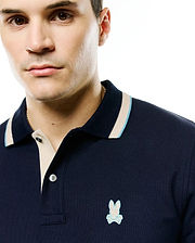 Men's Grover Pique Longsleeve Polo: Navy blue pique knit, classic fit, beige placket, ribbed collar with light blue/beige tipping, small embroidered light blue Psycho Bunny skull logo left chest. (2)