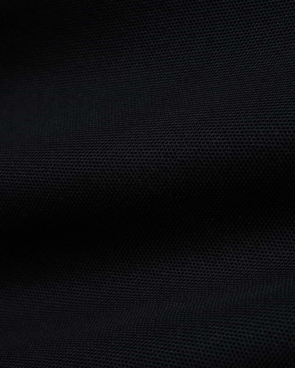 Men's Grover Pique Longsleeve Polo in rich black, showcasing its premium, finely textured pique knit fabric, a versatile and comfortable staple for sophisticated streetwear. (6)