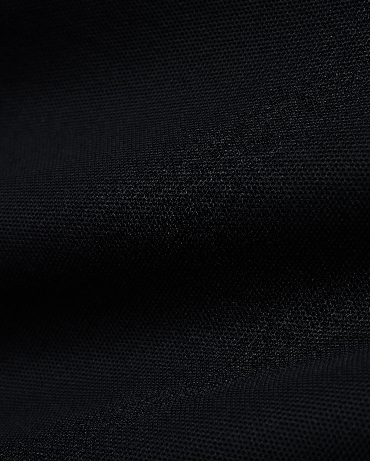 Men's Grover Pique Longsleeve Polo in rich black, showcasing its premium, finely textured pique knit fabric, a versatile and comfortable staple for sophisticated streetwear. (6)