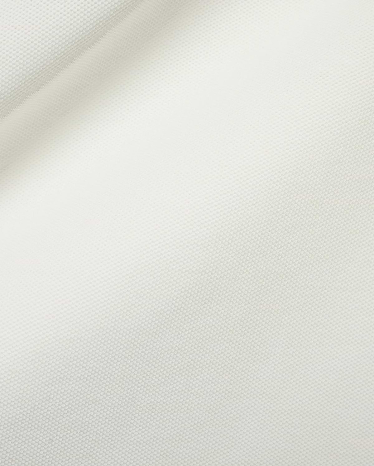 Men's Grover Pique Longsleeve Polo in a pristine white hue, highlighting the distinctive, breathable, and finely textured pique knit fabric, ideal for refined streetwear. (6)
