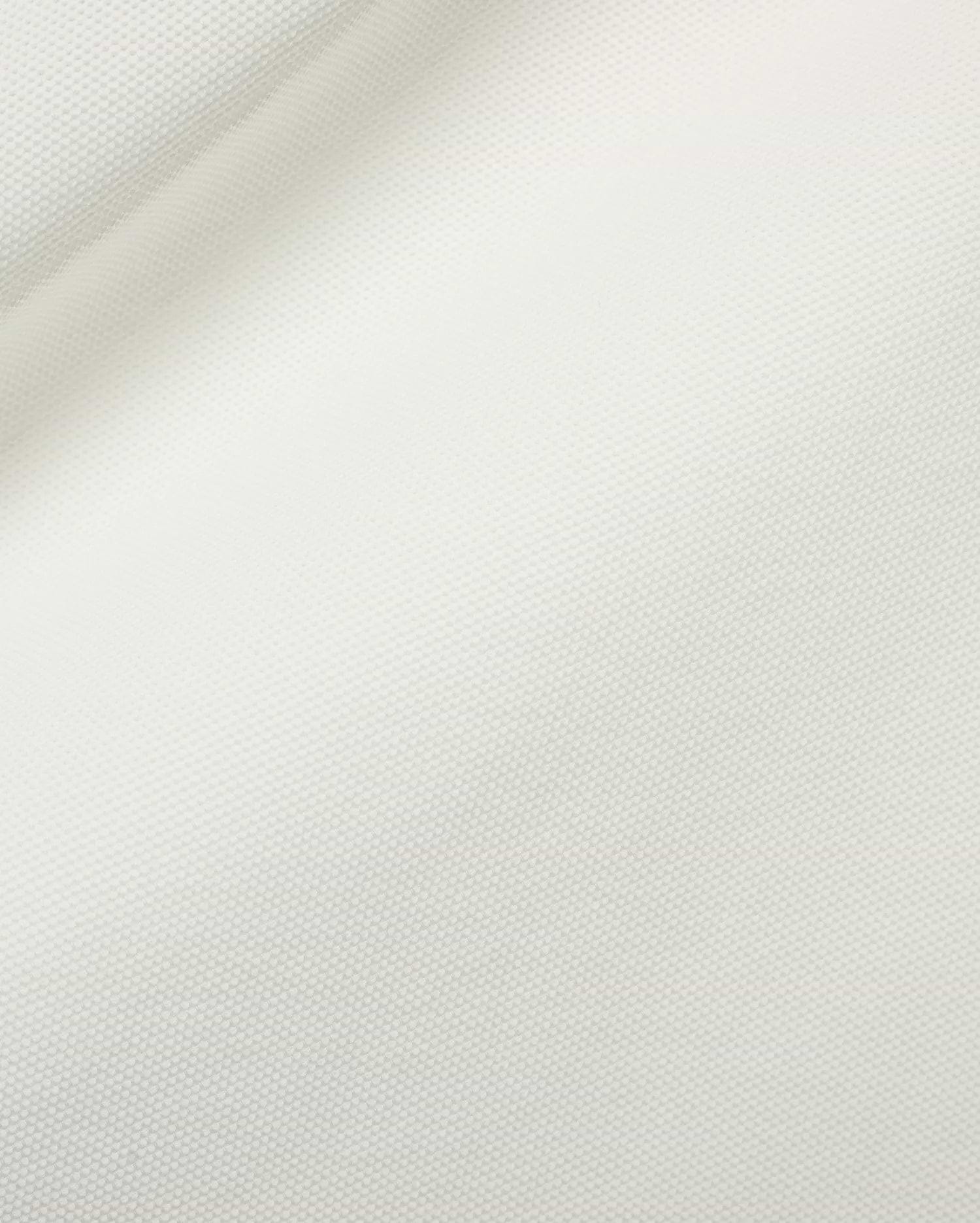 Men's Grover Pique Longsleeve Polo in a pristine white hue, highlighting the distinctive, breathable, and finely textured pique knit fabric, ideal for refined streetwear. (6)