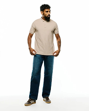 Mens Ringston Pique Polo in classic fit, light beige pique fabric with white tipping on the ribbed collar and cuffs, featuring a small embroidered Psycho Bunny skull logo on the left chest.