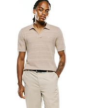 Mens Devon Braided Stitch Knit Polo in beige, featuring a classic fit, open collar, and a small embroidered Psycho Bunny skull logo on the left chest.