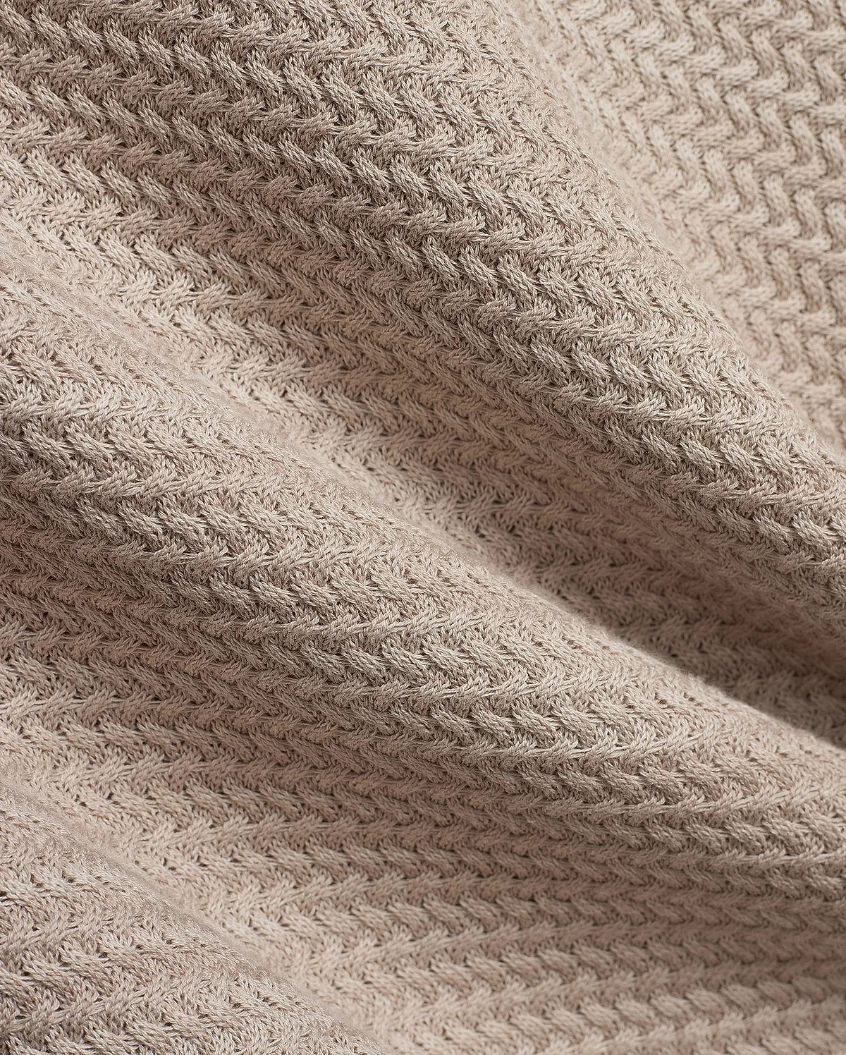 Mens Devon Braided Stitch Knit Polo, a premium beige knit polo featuring a refined, intricate braided stitch pattern, showcasing luxurious texture and sophisticated style.