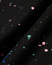 Mens Malcolm Splatter Polo, a premium black pique knit polo featuring a dynamic, all-over paint splatter print in vibrant pink, teal, and blue, embodying refined streetwear style. (6)
