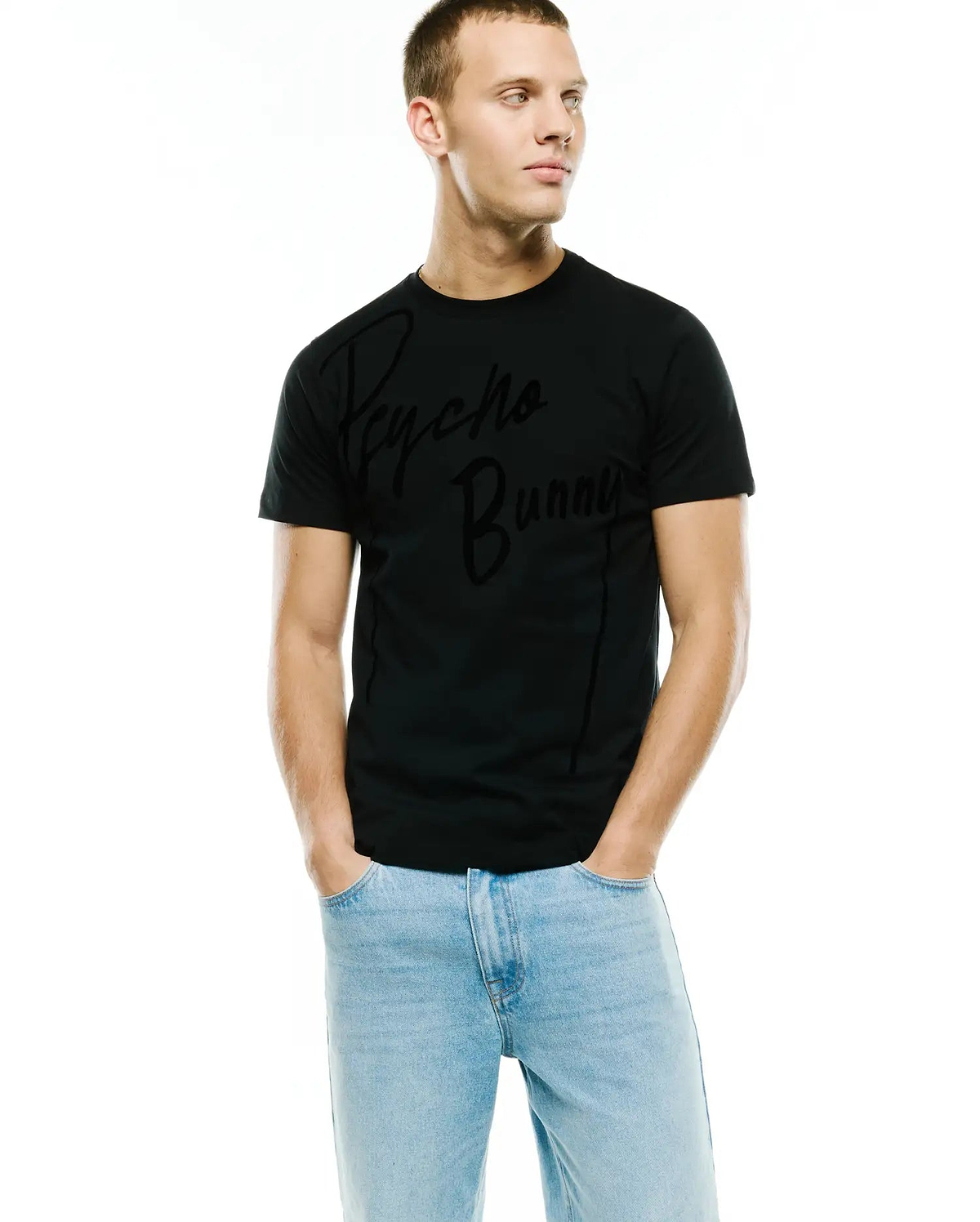 Mens Soren Graphic Tee, black classic fit jersey knit featuring a large, subtly textured tonal Psycho Bunny script logo on the central chest and a refined vertical seam detail. (4)