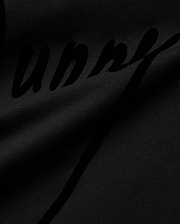 Mens Soren Graphic Tee, a premium black jersey knit t-shirt with a soft drape, featuring a large, subtly textured tonal black script Bunny graphic print, reflecting refined streetwear aesthetics. (6)