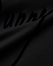 Mens Soren Graphic Tee, a premium black jersey knit t-shirt with a soft drape, featuring a large, subtly textured tonal black script Bunny graphic print, reflecting refined streetwear aesthetics. (6)