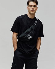 Mens Dustin Oversized Tee, a black oversized t-shirt with an all-over embossed checkerboard pattern featuring the Psycho Bunny skull logo, crafted from textured jersey fabric.