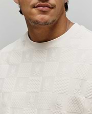 Cream Mens Dustin Oversized Tee with an all-over textured knit checkered pattern, featuring alternating squares of subtle texture and embossed Psycho Bunny skull logos.