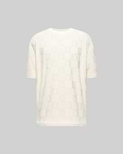 Mens Dustin Oversized Tee, cream jacquard knit with an all-over checkerboard pattern featuring embossed Psycho Bunny skull logos and textured squares.