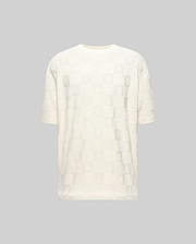 Mens Dustin Oversized Tee, cream jacquard knit with an all-over checkerboard pattern featuring embossed Psycho Bunny skull logos and textured squares.