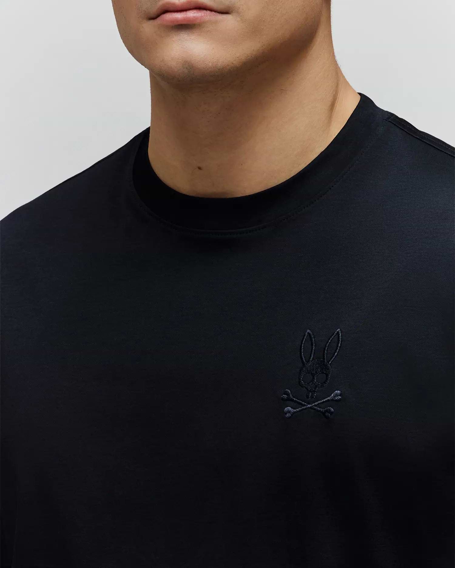 Black Mens Oscar Oversized Tee in smooth jersey knit, featuring a small, tonal black embroidered Psycho Bunny skull and crossbones logo on the left chest.