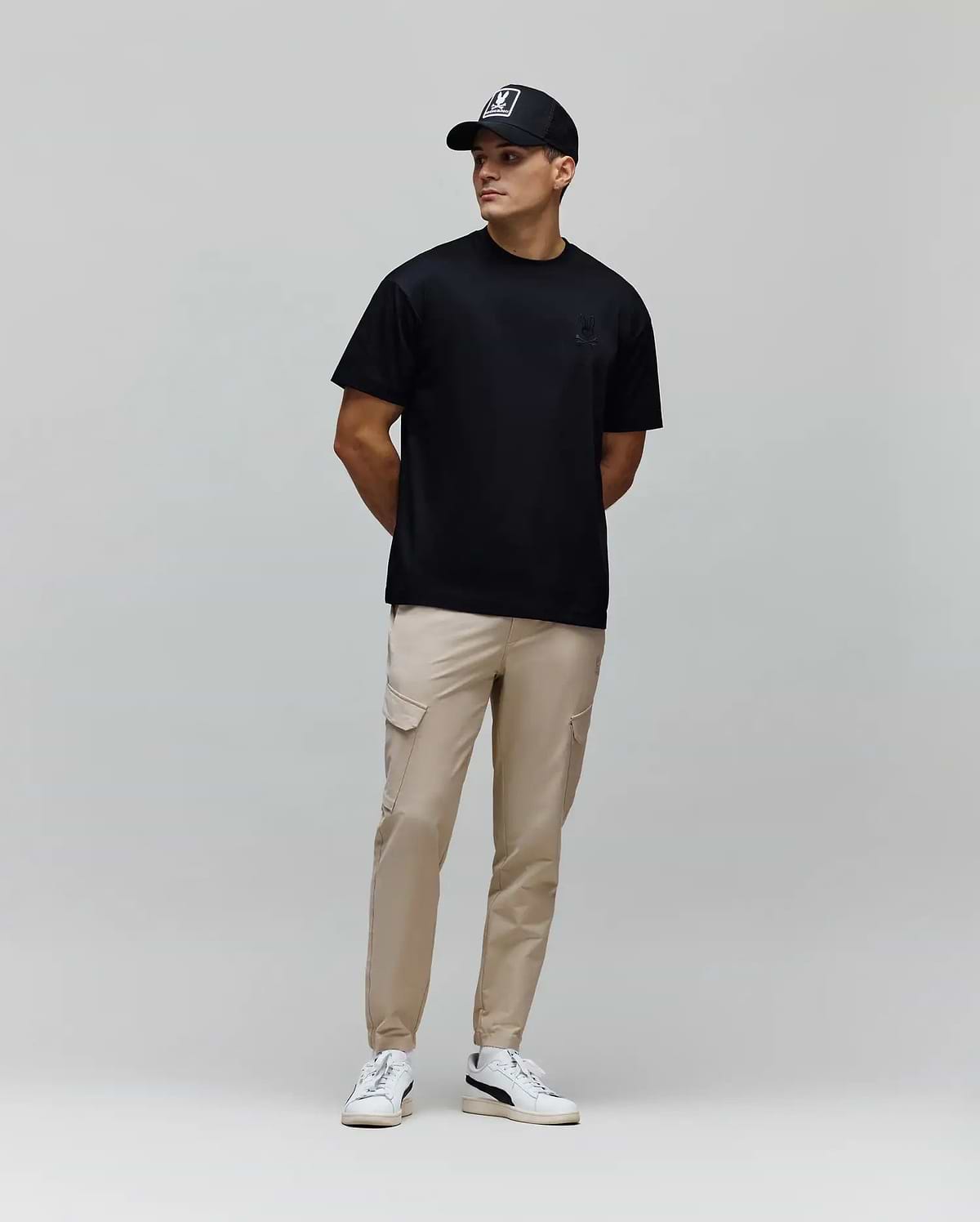 Mens Oscar Oversized Tee, a black smooth jersey t-shirt featuring a relaxed fit and a small, tonal embroidered Psycho Bunny skull logo on the left chest.