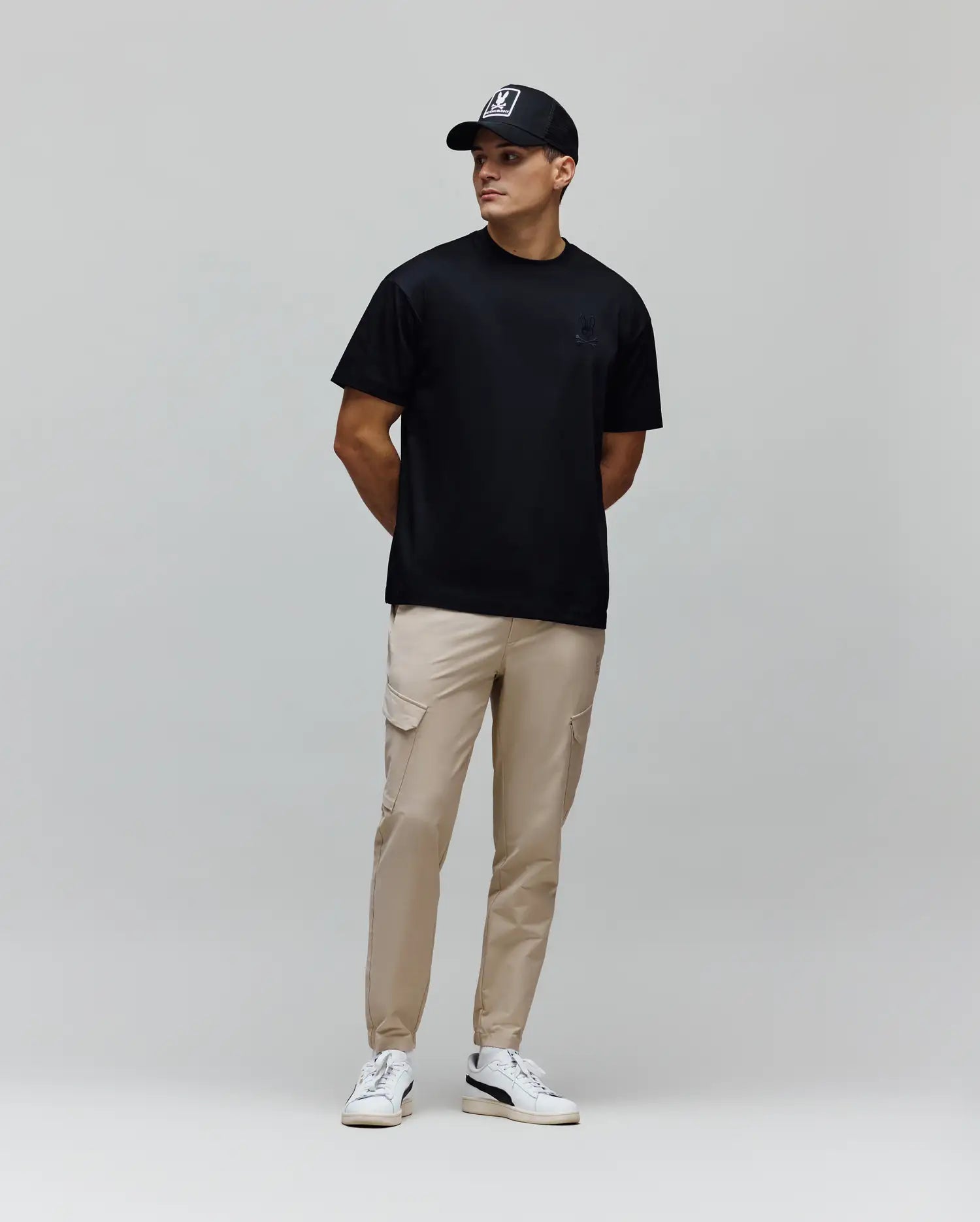 Mens Oscar Oversized Tee, a black smooth jersey t-shirt featuring a relaxed fit and a small, tonal embroidered Psycho Bunny skull logo on the left chest.