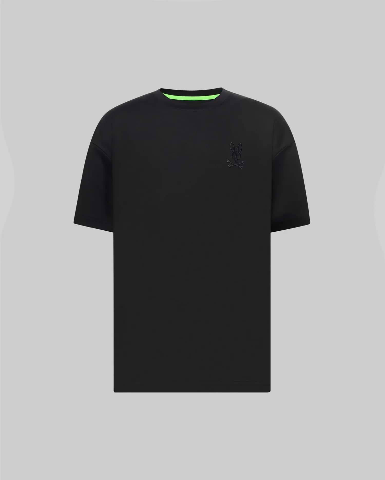 Mens Oscar Oversized Tee in black jersey knit, featuring a relaxed fit, small tonal embroidered Psycho Bunny skull logo on the left chest, and a vibrant neon green inner collar.