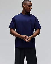Mens Oscar Oversized Tee in deep navy blue, featuring a small, tonal embroidered Psycho Bunny skull logo on the left chest, crafted from smooth jersey fabric for a relaxed fit.