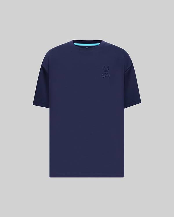 Mens Oscar Oversized Tee in navy blue jersey knit, featuring a relaxed fit, small embroidered Psycho Bunny skull logo on the left chest, and a light blue accent stripe on the inner collar.