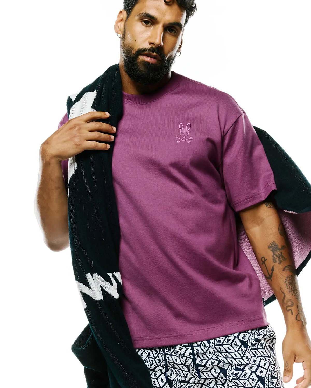 MENS OSCAR RELAXED FIT TEE in rich plum jersey knit, showcasing a small, tonal embroidered Psycho Bunny skull logo on the left chest, embodying refined streetwear.