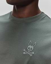 Mens Oscar Oversized Tee in dark olive green jersey knit, featuring a small, embroidered light grey Psycho Bunny skull and crossbones logo on the left chest. (2)