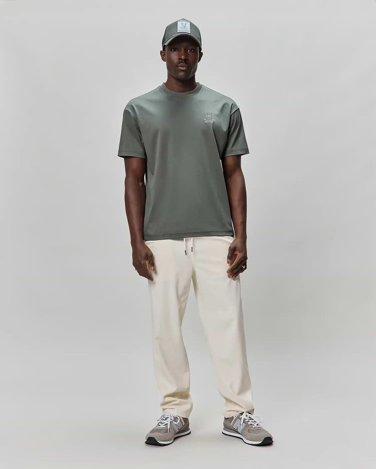 Mens Oscar Oversized Tee in dark sage green, featuring a smooth jersey knit fabric and a small, embroidered light grey Psycho Bunny skull logo on the left chest for a refined streetwear look. (3)